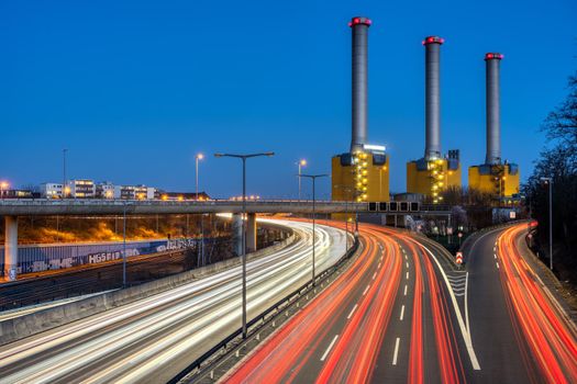Highway and power station at night seen in Berlin, Germany