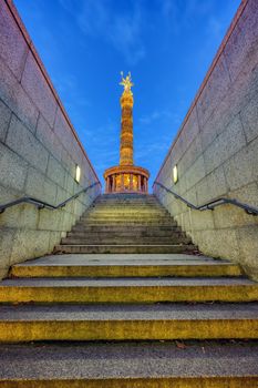 The Victory Column in Berlin at night seen from an underpass
