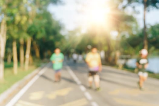 Blur public exercise park for people runnung, jogging and walking. Healthy living lifestyle background.