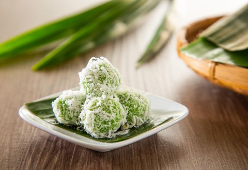 Ondeh ondeh is a traditional Malay snack made of rice ball filled with brown sugar, coated in grated coconut.