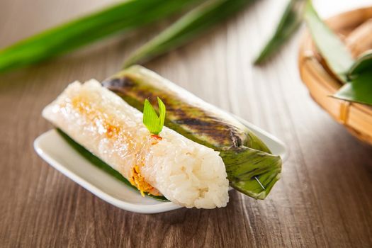 Pulut Panggang grilled glutinous rice wrapped in banana leaf with stuffed savory fillings