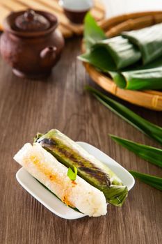 Pulut Panggang grilled glutinous rice wrapped in banana leaf with stuffed savory fillings