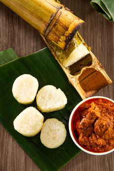 Lemang. Glutinous rice is wrapped with lerek or banana leaf encased in bamboo culm and cooked in open fire.