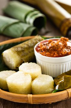 Lemang. Glutinous rice is wrapped with lerek or banana leaf encased in bamboo culm and cooked in open fire.