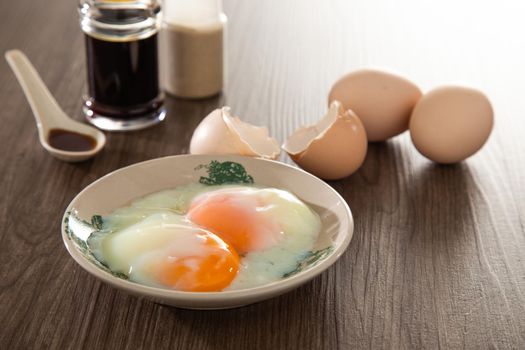 Common oriental breakfast set in Malaysia consisting of coffee, nasi lemak, toast bread and half-boiled egg