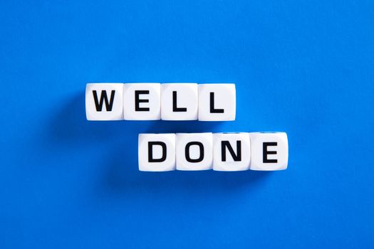 Well done phrase letters on blue background