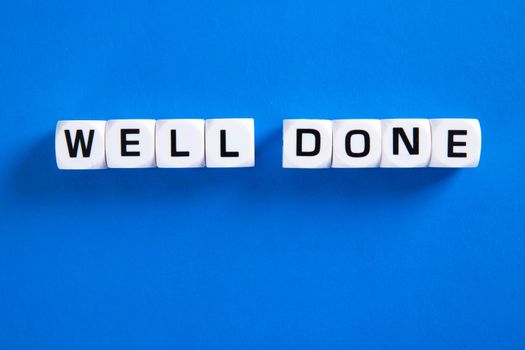 Well done phrase letters on blue background
