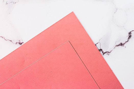 Pink A4 papers on white marble background as office stationery flatlay, luxury branding flat lay and brand identity design for mockups