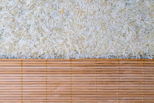 texture of rice grains on a bamboo table close-up. High quality photo