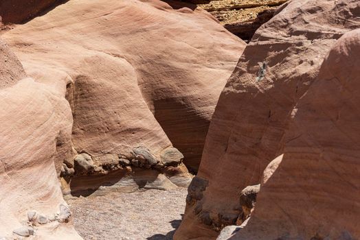 An amazing place in Israel is called the Red canyon and Nahal Shani, Southern District. Totally worth visiting because of its stunning stony structure. High quality photo