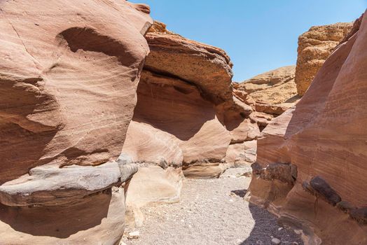 An amazing place in Israel is called the Red canyon and Nahal Shani, Southern District. Totally worth visiting because of its stunning stony structure. High quality photo