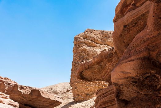 An amazing place in Israel is called the Red canyon and Nahal Shani, Southern District. Totally worth visiting because of its stunning stony structure. High quality photo