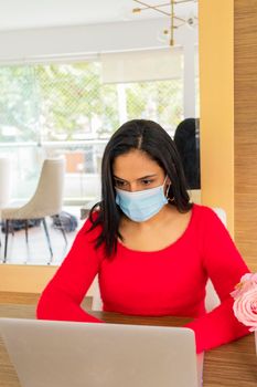 Beauty hispanic woman is working at home