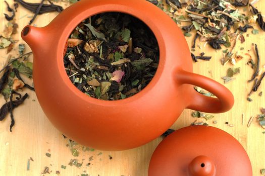 Leaf tea, willow tea, brewed in a clay brown teapot. High quality photo