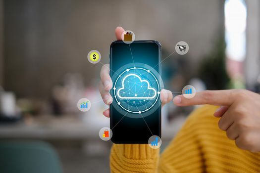 Female using smartphone with icon graphic cloud cyber security network of connected devices and personal data security