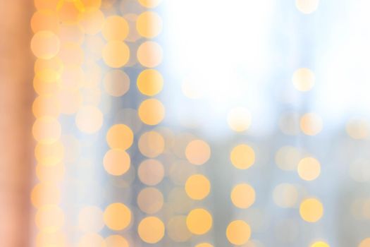 Yellow bokeh lights blur . new year's defocus. lights of the bokeh garland. Copy space to the side