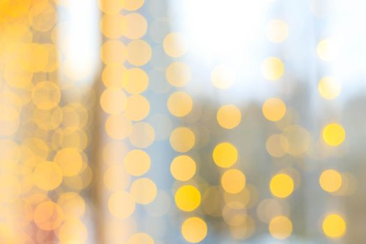 Yellow bokeh lights blur . new year's defocus. lights of the bokeh garland. Copy space to the side