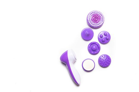 Electric isolate facial massager . Purple massager. Facial care. Cosmetology. Women's care . Article about the health of the face . Isolated object . Copy space