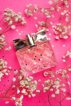 The perfume and flowers layout . Aromatherapy. Women's perfume. White flowers. Article about the choice of fragrance. Article about women's perfume. A bottle of perfume. Fresh flowers.