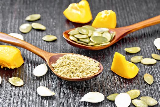 Flour and pumpkin seeds in spoons, slices of vegetable on a wooden board background