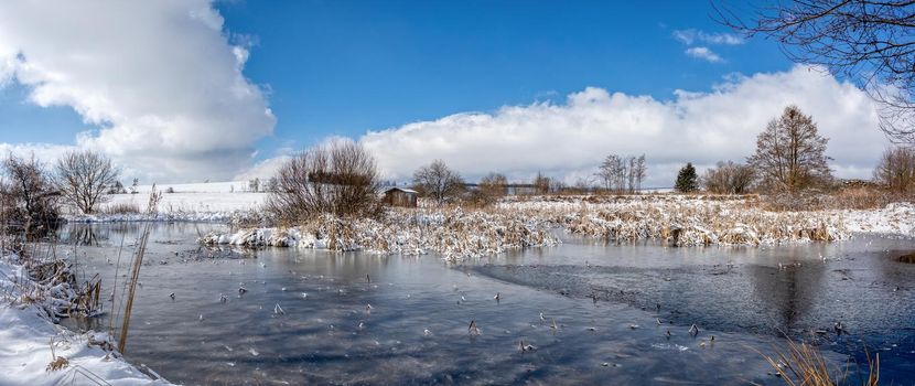 Beautiful winter rural landscape with frozen small pond. Czech beautiful highland vysocina european countryside