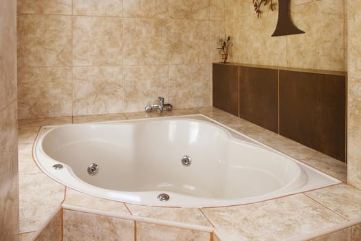 Corner Bathtub Decoration in Bathroom Interior.