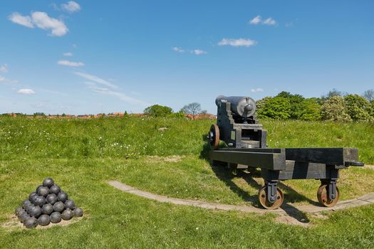 Old bronze cannon on rampart in city Fredericia, Denmark.