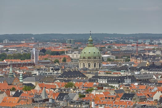 Skyline of scandinavian city of Copenhagen in Denmark during a cloudy day.