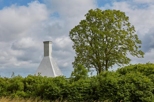 The roofs and chimneys of very small smoke houses so typical and famous for small village of Svaneke on Bornholm island in Denmark.