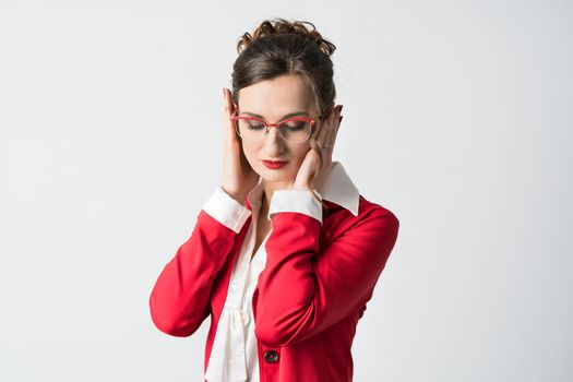 Businesswoman hear no evil covering her ears