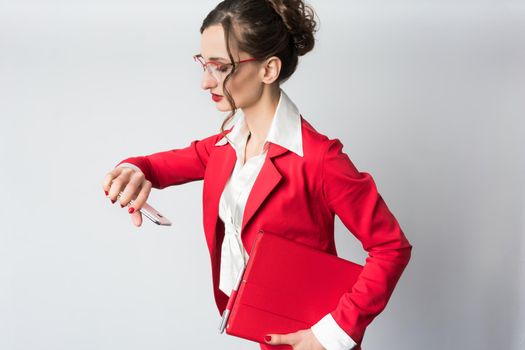 Businesswoman being late to her meeting checking the time on wristwatch