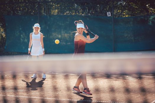 Woman in a tennis double on a sunny day