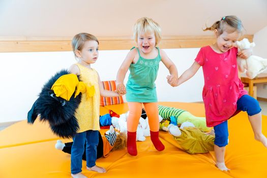Children having fun in nursery school dancing