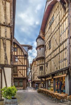 Street with historical half-timbered houses in Troyes, France