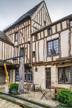 Street with historical half-timbered houses in Noyers (Noyers-sur-Serein), Yonne, France