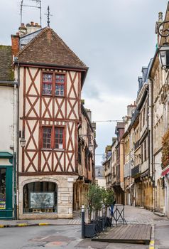 Street with historical half-timbered houses in Dijon, France