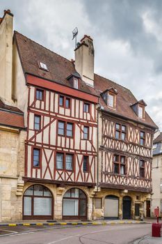 Street with historical half-timbered houses in Dijon, France