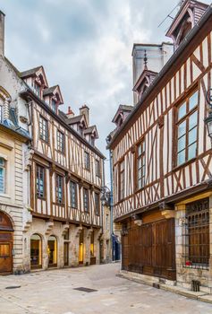 Street with historical half-timbered houses in Dijon, France