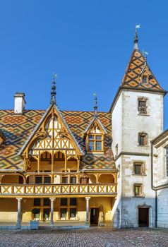 Hospices de Beaune or Hotel-Dieu de Beaune is a former charitable almshouse in Beaune, France. Courtyard, internal facade with polychrome roof