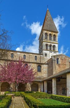 Saint-Philibert de Tournus is a medieval church, the main surviving building of a former Benedictine abbey in Tournus, France. View from garden