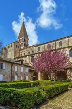 Saint-Philibert de Tournus is a medieval church, the main surviving building of a former Benedictine abbey in Tournus, France. View from garden