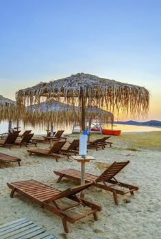 Thatched umbrella on the Toroni beach in Sithonia peninsula, Chalkidiki, Greece