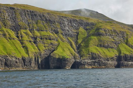 Wild and rocky coast of Faroe Islands, Denmark.