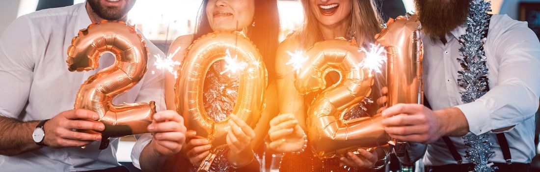 women celebrating the new year 2021 with wine