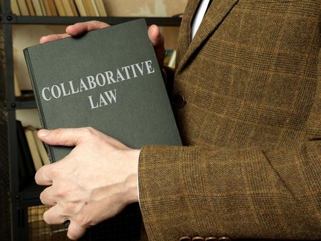 Collaborative law is in the hands of a lawyer in a jacket.