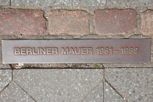 Place of the Berlin wall until 1989, remained foundation of the wall with information as part of a street near Checkpoint Charlie was a Berlin Wall crossing point between East and West Berlin, Germany
