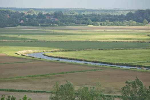 Beautiful countryside landscape with fields and small river near Kiel - Schleswig-Holstein - Germany.