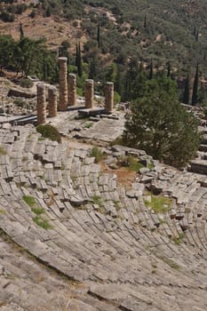 Panoramic view of Ancient Theater of Delphi, Phocis in Greece. The theater, with a total capacity of 5,000 spectators, is located at the sanctuary of Apollo. UNESCO World heritage.