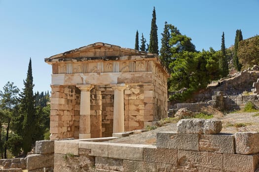 The Athenian treasury in Delphi, Greece in a summer day