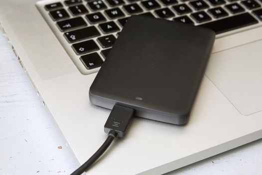 External Hard Disk Over Laptop Keyboard.